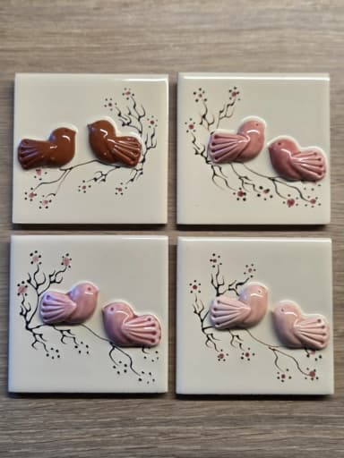Set of four small ceramic wall tiles