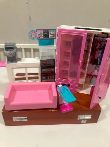 Barbie wardrobe and playset with kitchen, diving tower, and sofa