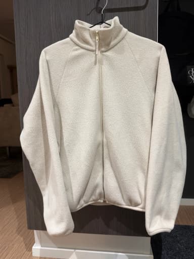 Beige Uniqlo fleece jacket size XS with zipper and pockets