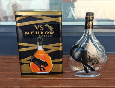 Meukow Cognac tin box and empty bottle set with black and gold design