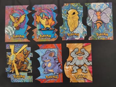 Pokemon Topps Die Cuts collection with various characters
