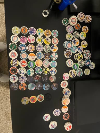 Large collection of original POG game tokens including Batman theme