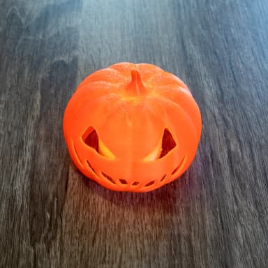 3D printed LED candle holder shaped like a Halloween pumpkin