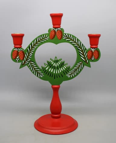 Vintage wooden candle holder with pine cones from the 1900s