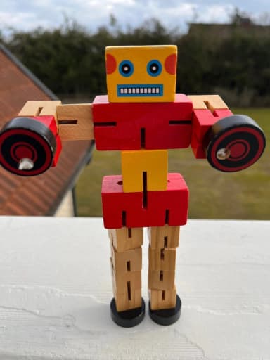 Wooden robot toy available in auction