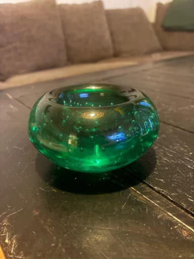 Green glass plate with bubble pattern
