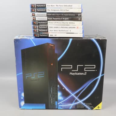 PlayStation 2 Konsole mit Controller und Spiel