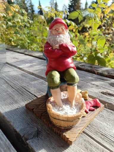 Santa figurine made of artificial material, about 18 cm tall