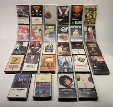 Collection of 28 mixed cassette tapes with rock, pop, and classics