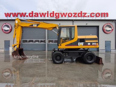 Excavadora de ruedas Caterpillar M315 del año 2000