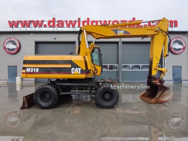 Excavadora de ruedas Caterpillar M318 del año 2001