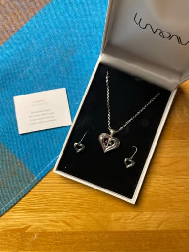 Handcrafted silver Lumikki pendant and earrings by Eelis Aleksi