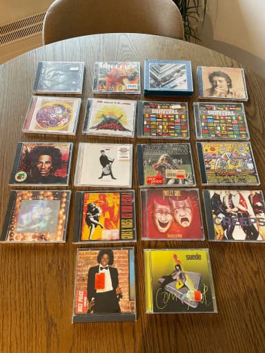 Colección de 18 CDs de rock, reggae y pop