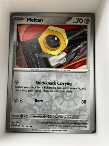 Carta Meltan 103/142 reverse holo de la serie Stellar Crown