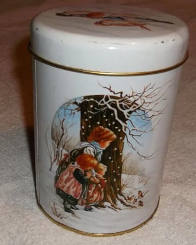 Vintage metal tin with birds and children from the 1980s