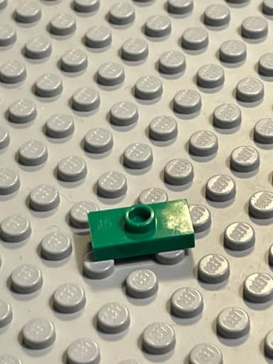 Vihreä muokattu LEGO-laatta 1x2 uralla ja pohjanupilla