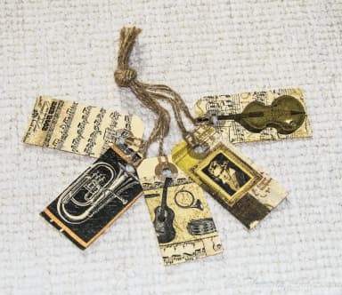 Set of 5 hand-decorated music-themed tags with natural string