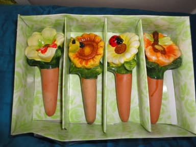Decorative vintage flower-shaped terracotta watering cones