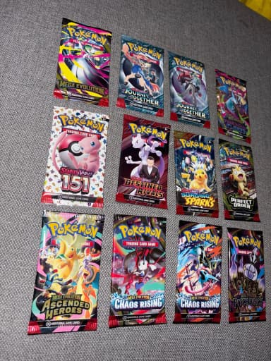 12 Pokemon booster packs from 10 different sets available