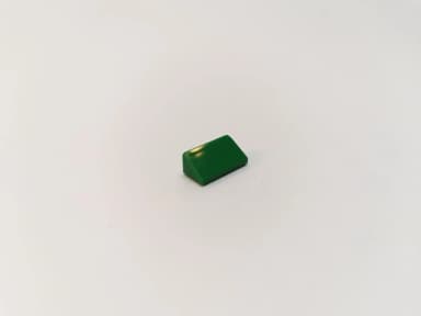 Green LEGO slope tile 1x2x2/3 part 85984