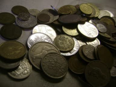 Unsorted foreign coins weighing 1.3 kg may contain silver