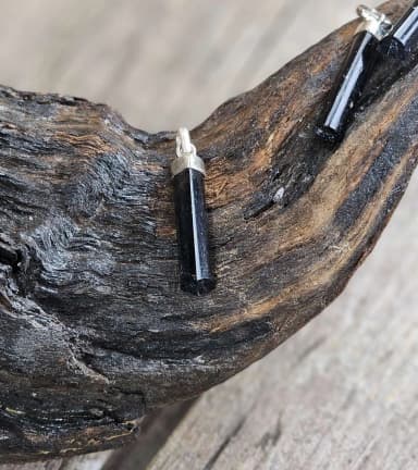 Polished black tourmaline pendant with 925 silver setting