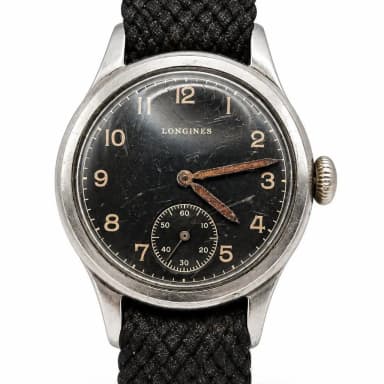 Reloj vintage Longines con esfera negra en funcionamiento